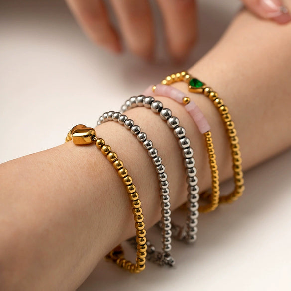 Wholesale Women's Titanium Steel And Stainless Steel Bracelet With 16K Gold Beads Green Love Zircon Geometric Pattern Electroplated