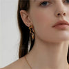 Wholesale Women's Titanium Steel Asymmetric Lava Drop Earrings With Geometric Pattern And Electroplating Design