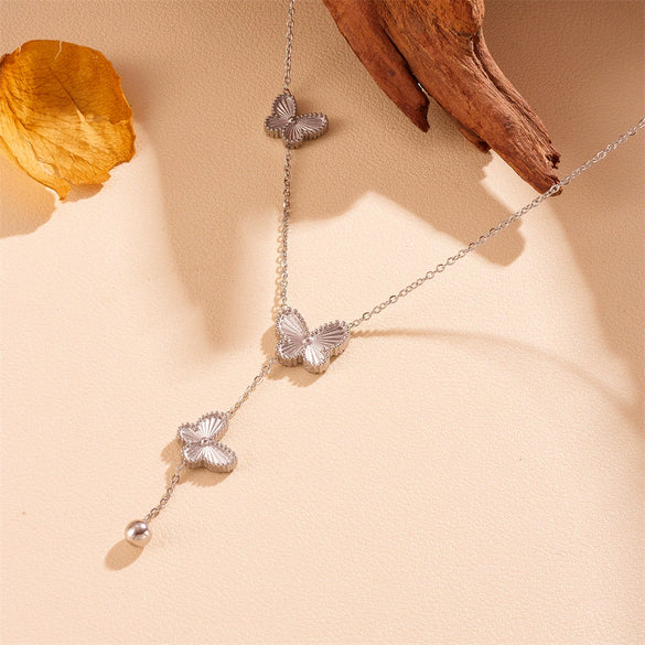 Wholesale Women's Titanium Steel Doublesided Butterfly Flower Ball Tassel Necklace With Geometric Pattern And Electroplating Treatment