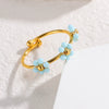 Wholesale Women's Titanium Steel Flower Beaded Ring With Electroplating Design