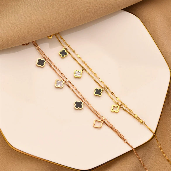 Wholesale Women's Titanium Steel Fourleaf Clover Hollow Inlaid Shell Pendant Bracelet With Geometric Styling And Electroplating Treatment
