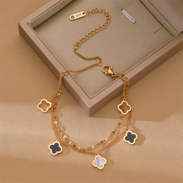 Wholesale Women's Titanium Steel Fourleaf Clover Hollow Inlaid Shell Pendant Bracelet With Geometric Styling And Electroplating Treatment