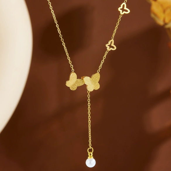 Wholesale Women's Titanium Steel Geometric Butterfly Tassel Pearl Necklace With Real Gold Plating In The Furnace