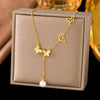 Wholesale Women's Titanium Steel Geometric Butterfly Tassel Pearl Necklace With Real Gold Plating In The Furnace