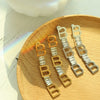 Wholesale Women's Titanium Steel Geometric Irregular Earrings With English Letter Stitching And Zircon Electroplated