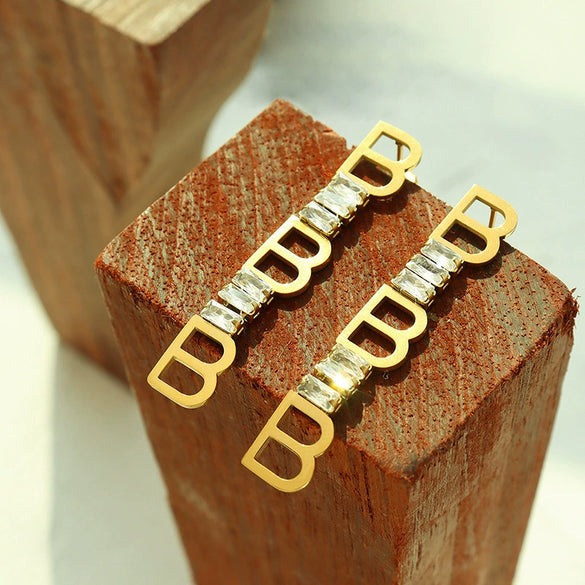 Wholesale Women's Titanium Steel Geometric Irregular Earrings With English Letter Stitching And Zircon Electroplated