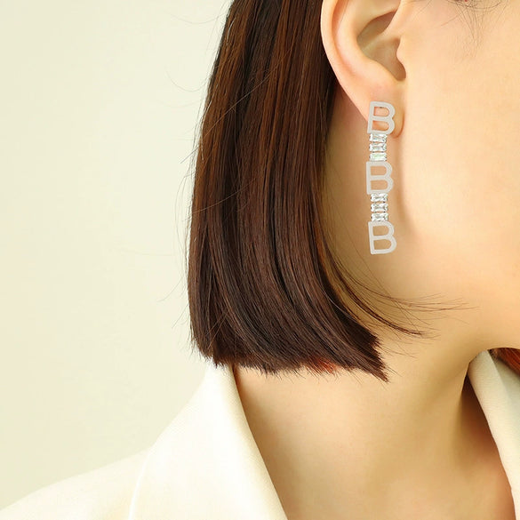 Wholesale Women's Titanium Steel Geometric Irregular Earrings With English Letter Stitching And Zircon Electroplated