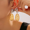 Wholesale Women's Titanium Steel Oval Hollow Earrings With Irregular Color Matching And 18K Gold Plated Electroplating Geometric Style