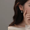Wholesale Women's Vintage Geometric Round Earrings Made Of S925 Sterling Silver And Imitation Pearls With Electroplating