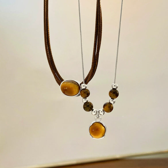 Wholesale Women's Vintage Leather Alloy Clavicle Chain Necklace With Artificial Tiger Eye Stone And Geometric Pattern Electroplated