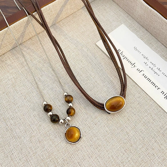 Wholesale Women's Vintage Leather Alloy Clavicle Chain Necklace With Artificial Tiger Eye Stone And Geometric Pattern Electroplated