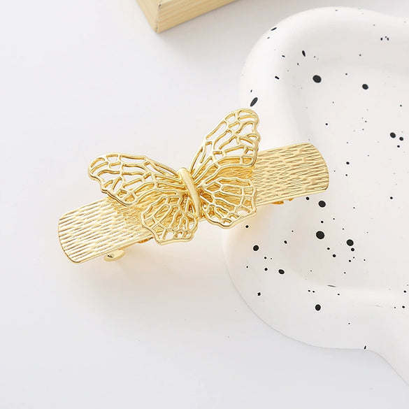 Wholesale Women's Zinc Alloy Hollow Metal Bow Spring Clip Hairpin With Electroplating And Baroque Style And Rhinestones