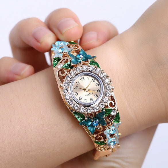 Women's Alloy Bracelet Quartz Watch With Diamonddecorated Butterfly Flower Design And Round Dial