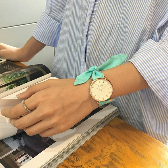 Women's Alloy Case Cloth Belt Round Dial Printed Logo Canvas Strap Leisure Watch