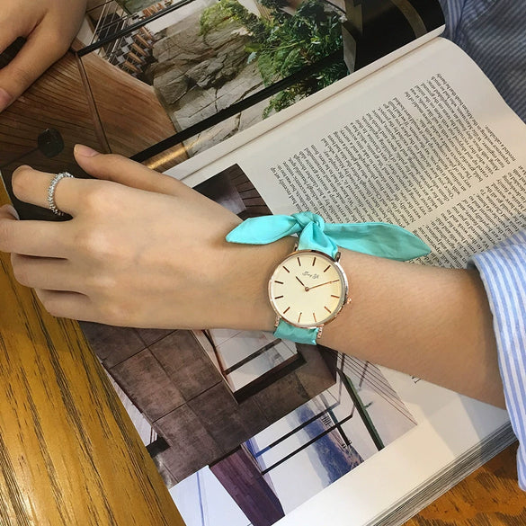 Women's Alloy Case Cloth Belt Round Dial Printed Logo Canvas Strap Leisure Watch