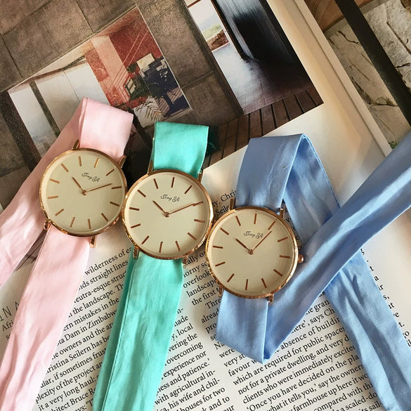 Women's Alloy Case Cloth Belt Round Dial Printed Logo Canvas Strap Leisure Watch