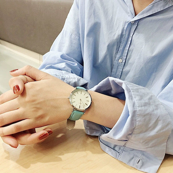 Women's Alloy Case Imitation Leather Strap Round Dial Watch With Printed Logo Retro And Leisure Style