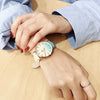 Women's Alloy Case Imitation Leather Strap Round Dial Watch With Printed Logo Retro And Leisure Style