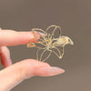 Women's Alloy Hollow Lily Brooch Electroplating Highend Light Luxury Design