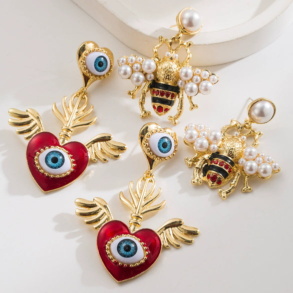Women's Alloy Pearl Inlaid Heart Devil's Eye Earrings With 925 Silver Needle