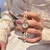 Women's Casual Mini Round Alloy Case And Strap Quartz Watch With Printed Logo