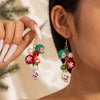 Women's Christmas Red Bow Bell Tassel Earrings With Electroplated Alloy Design And Plush Santa Claus Detail