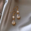 Women's Classical Gold Plated Carved Drop Shape White Stone Earrings With Color Preserving Electroplated Metal Design