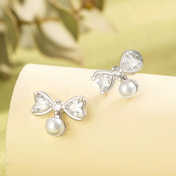 Women's Cute Bow Imitation Pearl Titanium Steel Earrings With Electroplating