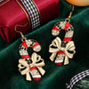 Women's Electroplated Alloy Caneshaped Drop Earrings With Rhinestone Bow And Festive Design