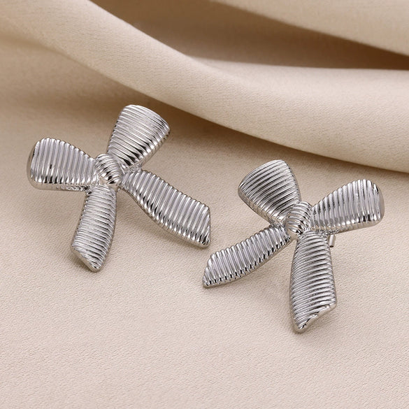 Women's Elegant Light Luxury Titanium Steel Earrings With Bow Pattern And 18K Gold Plated Electroplating Design