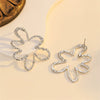 Women's Exaggerated Hollow Floral Earrings In Electroplated Zinc Alloy With A Simple Elegant Design
