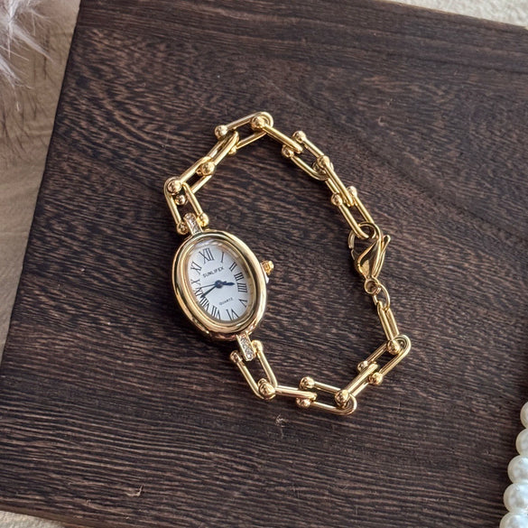 Women's Fashion Alloy Bracelet Watch With Cut Out Design And Roman Numerals