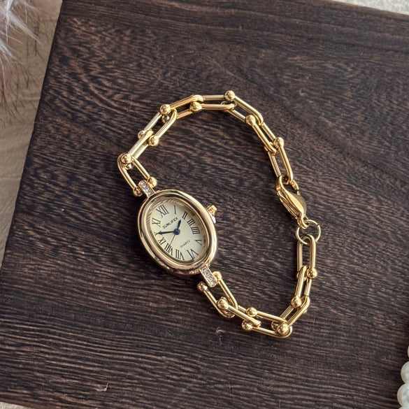 Women's Fashion Alloy Bracelet Watch With Cut Out Design And Roman Numerals
