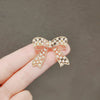 Women's Fashion Light Luxury Alloy Hollow Bow Brooch With Leaves Pattern And Electroplating Treatment