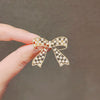Women's Fashion Light Luxury Alloy Hollow Bow Brooch With Leaves Pattern And Electroplating Treatment