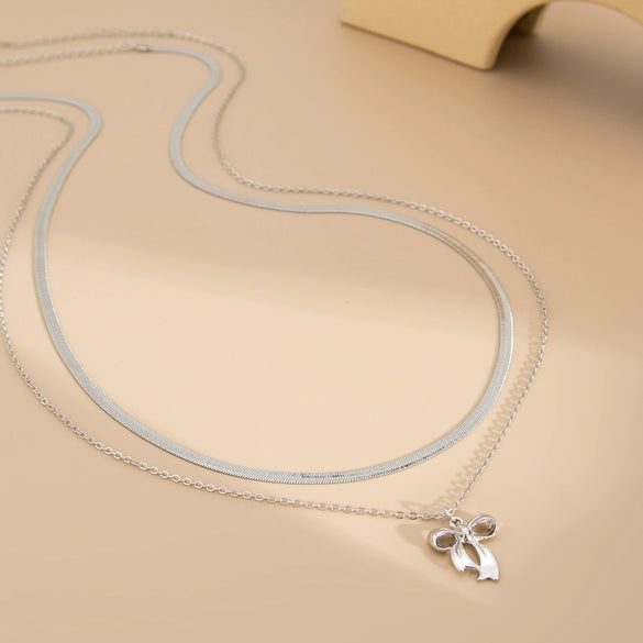 Women's Fashion Metal Waist Chain With Bow Pendant And Snake Bone Design Made Of Copper Chain Alloy