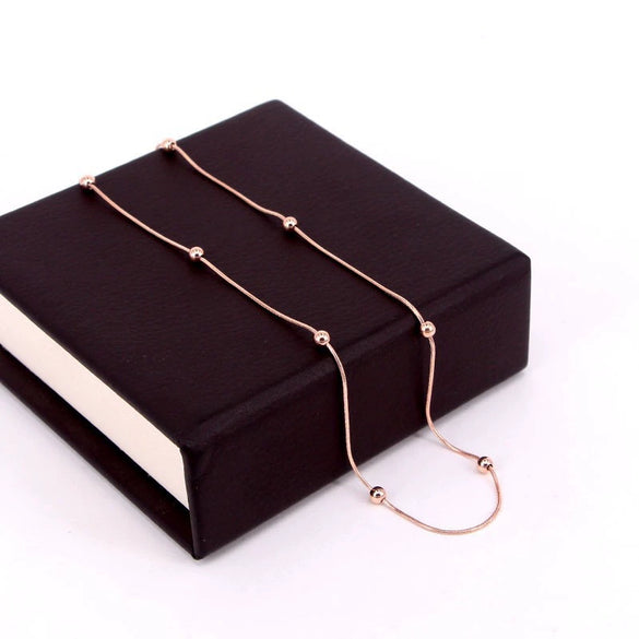 Women's Fashion Titanium Steel Rose Gold Beads Snake Bone Chain Necklace With Pearlescent Treatment