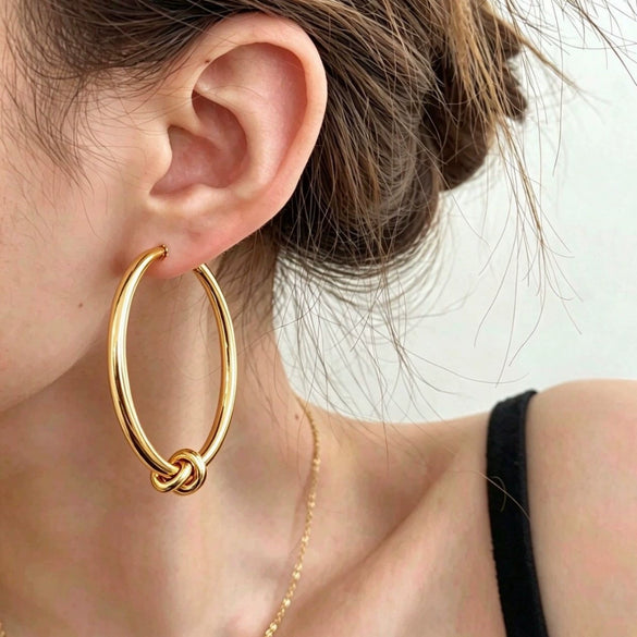 Women's Geometric Knotted Hoop Earrings In Iron With Stainless Steel Posts And Electroplated Gold And Silver Finish