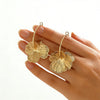 Women's Goldtone Flower Hoop Earrings With Exaggerated Floral Design Electroplated Metal Finish And Stainless Steel Ear Posts Elegant Statement Jewelry