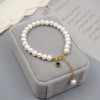 Women's Handmade Freshwater Pearl Beaded Bracelet With Geometric Design And Small Pendant