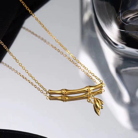 Women's Highrise Bamboo Ball Chain Titanium Steel Bracelet With Gold Inlaid Geometric Design