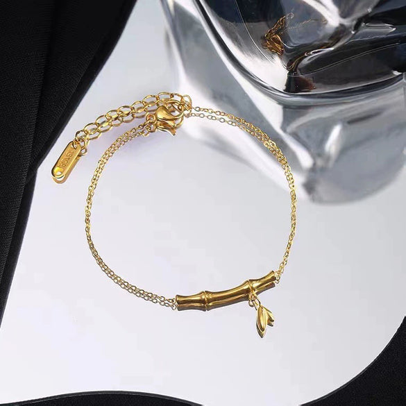 Women's Highrise Bamboo Ball Chain Titanium Steel Bracelet With Gold Inlaid Geometric Design