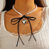 Women's Imitation Pearls And Organic Glass Heart And Bow Shaped Pendant Necklace With Electroplating