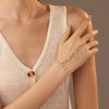 Women's Light Luxury Style Stainless Steel And 18K Gold Hand Jewelry With Pearl Bracelet And Finger Chain Integrated