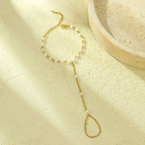 Women's Light Luxury Style Stainless Steel And 18K Gold Hand Jewelry With Pearl Bracelet And Finger Chain Integrated