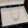 Women's Light Luxury Titanium Steel Necklace With Geometric Pattern And Inlaid Zircon Pendant On Cross Chain