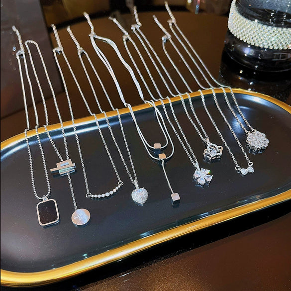 Women's Light Luxury Titanium Steel Necklace With Geometric Pattern And Inlaid Zircon Pendant On Cross Chain