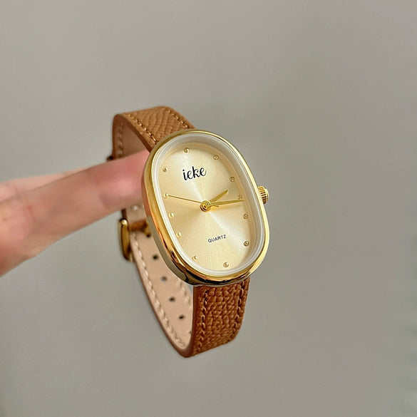 Women's Metal Case Genuine Leather Strap Oval Quartz Watch With Simple Temperament And Light Luxury Design