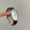 Women's Metal Case Genuine Leather Strap Oval Quartz Watch With Simple Temperament And Light Luxury Design