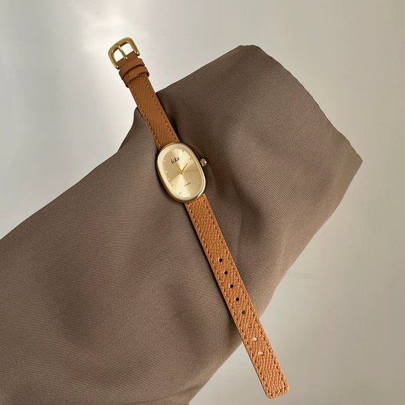 Women's Metal Case Genuine Leather Strap Oval Quartz Watch With Simple Temperament And Light Luxury Design